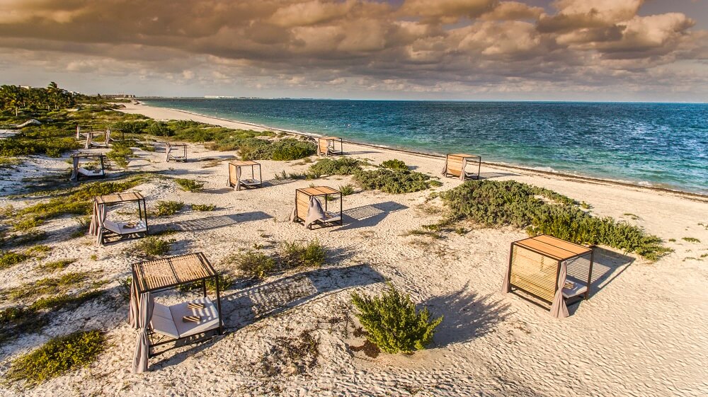 beach area with bali beds atelier hotel playa mujeres