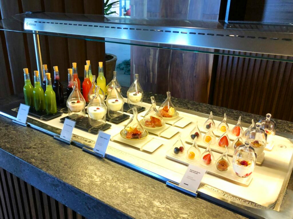 Resort buffet area with a variety of juices and desserts