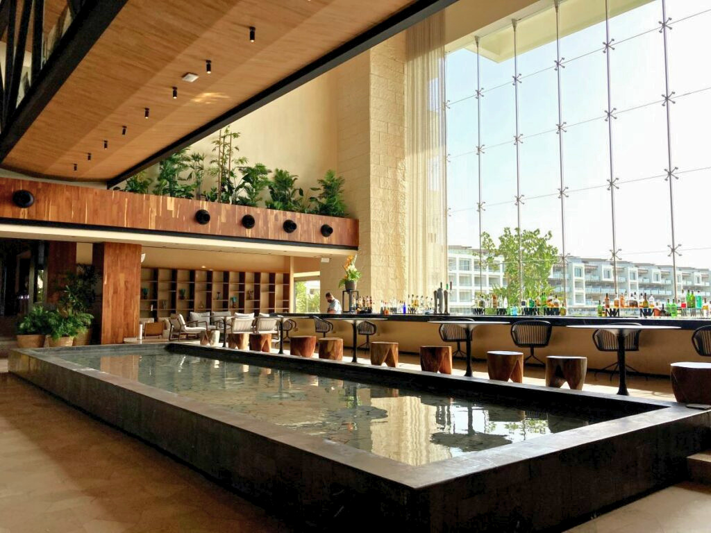Grand glass lobby wall of a chic, elegant and luxurious resort in playa mujeres cancun