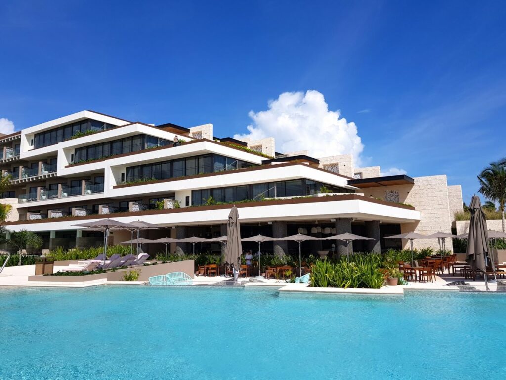 pool area and room buildings of a luxury all-inclusive resort in cancun