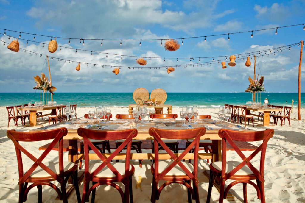 Resort beach venue with a dinning set up for a celebration