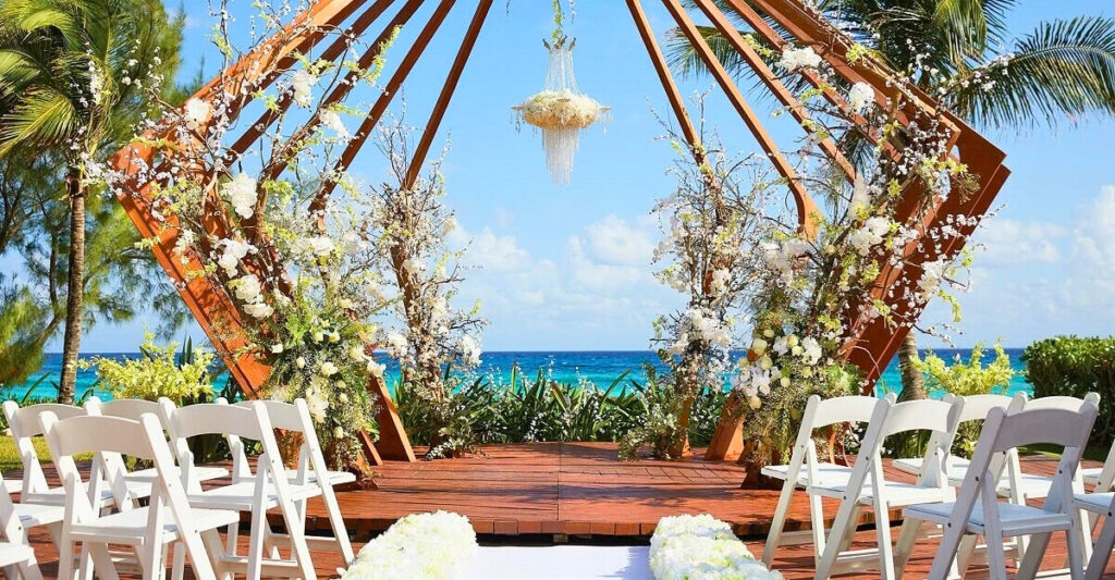 Wedding oceanfront gazebo with lots of white flowers