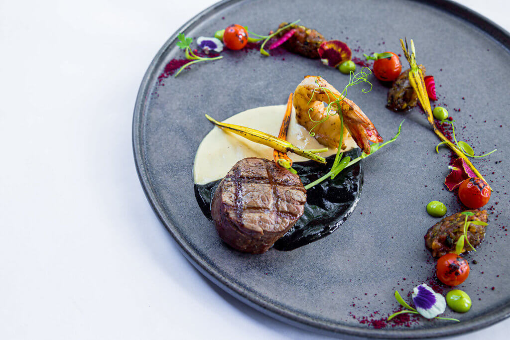 gourmet food plate with filet mignon and a shrimp