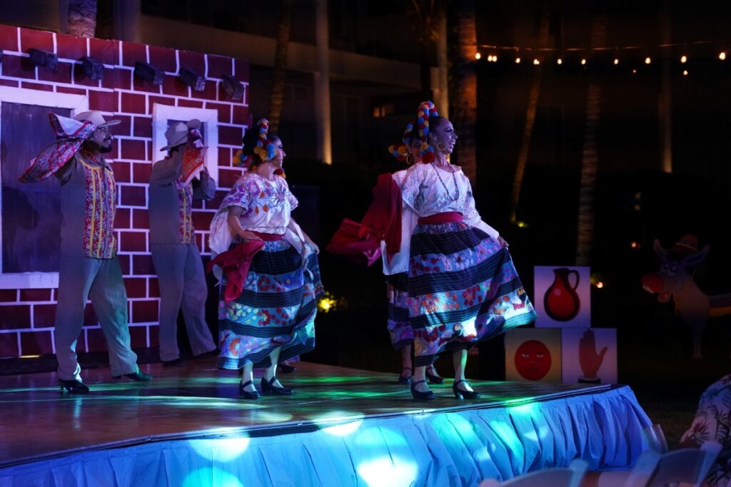 show of a traditional mexican dance with folk outfits