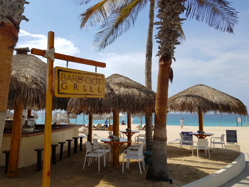 Beach grill bar with palala roof and ocean view
