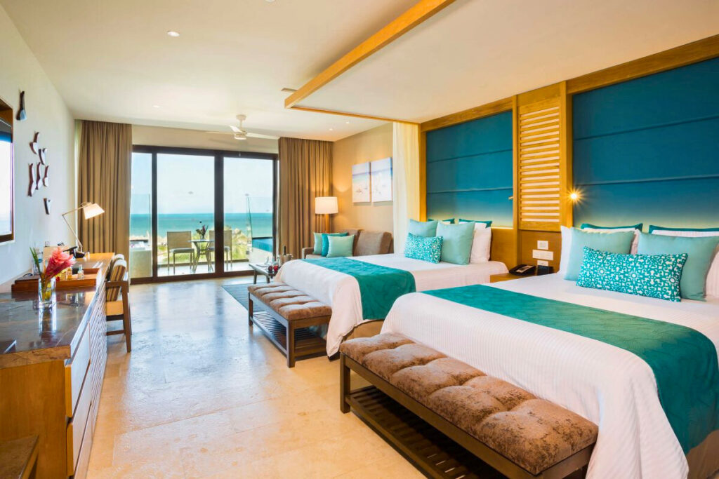Resort suite with two double beds and ocean view