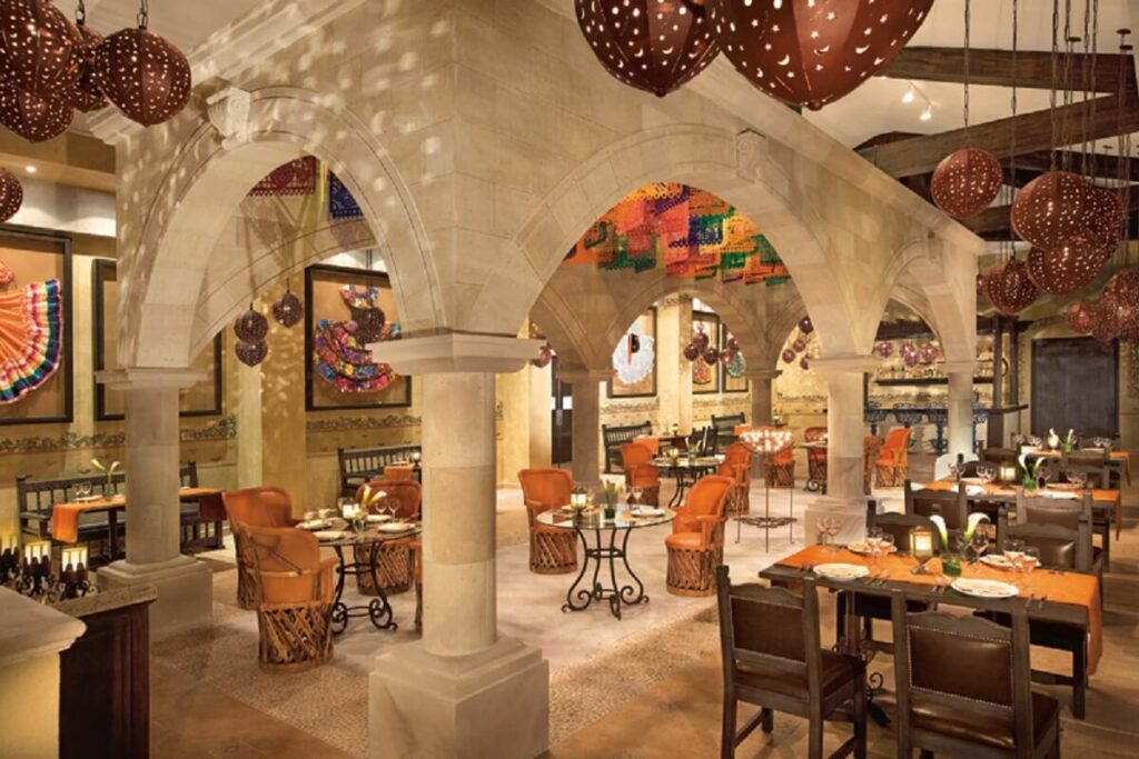 mexican restaurant with tradicional mexican dresses as decor