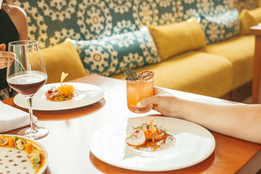 couple dining in a restaurant holding a glass