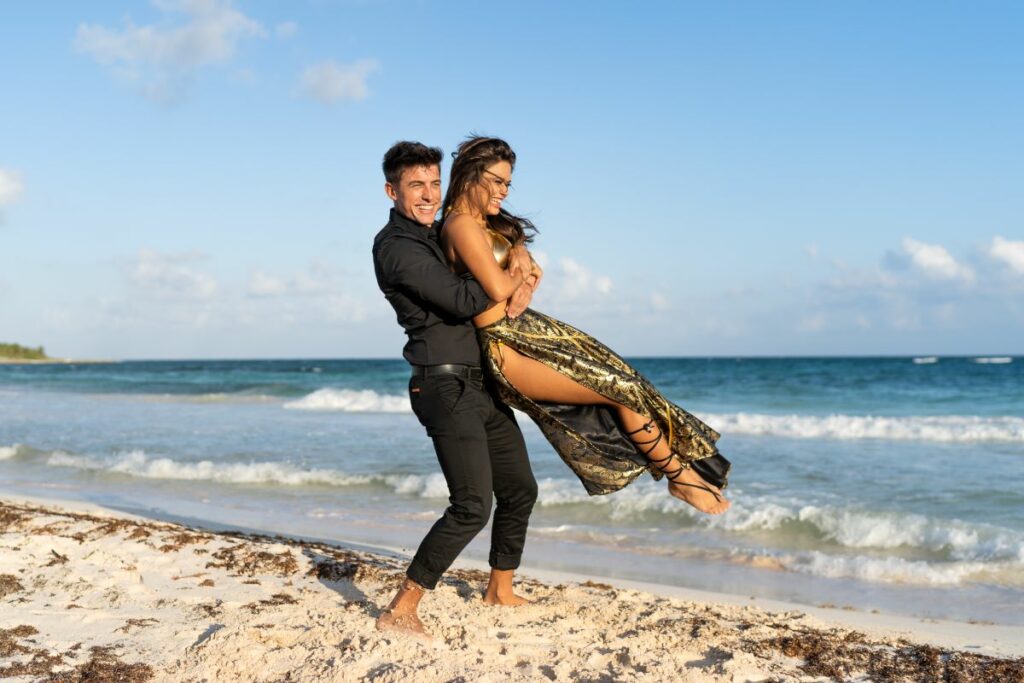 Happy couple celebrating their destination wedding on a Caribbean beach