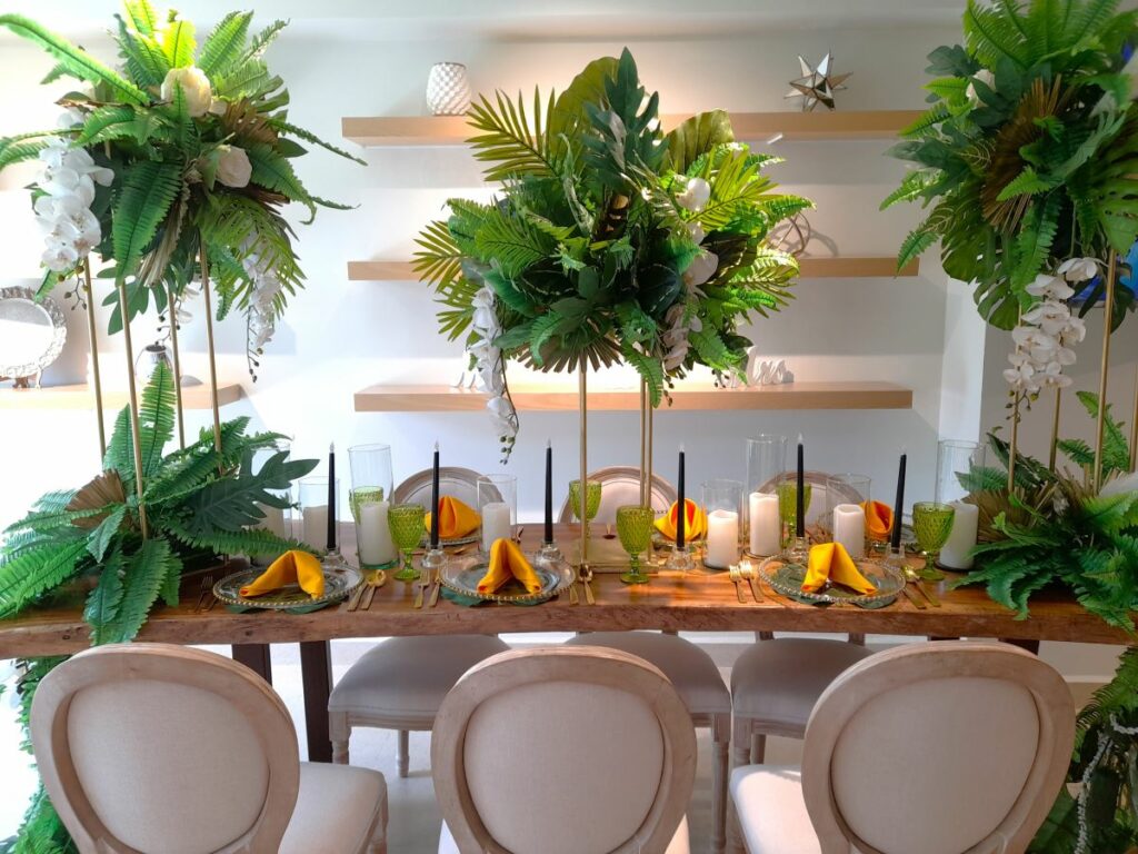 hotel wedding showroom with lots of decor and high greenery arrangements