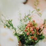 bride flower bouquet with roses and greenery