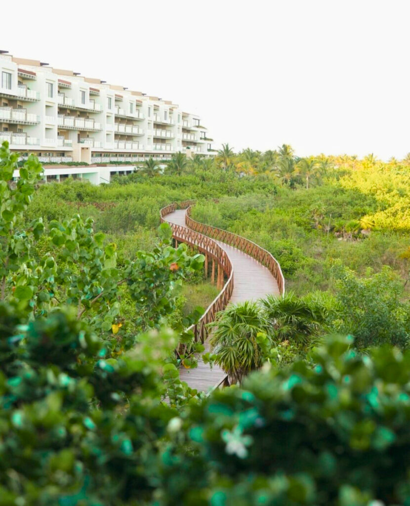 A bridge crossing through a resort garden