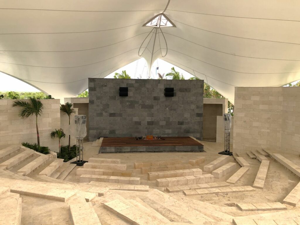 Large stone amphitheater with palmtrees