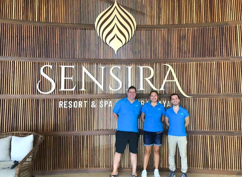 Hola Weddings team at Sensira Riviera Maya resort entrance