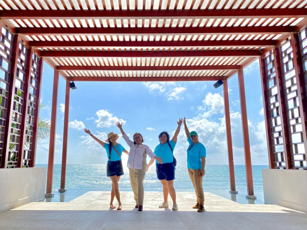 hola weddings staff with weddings manager of the dreams jade weddings resort