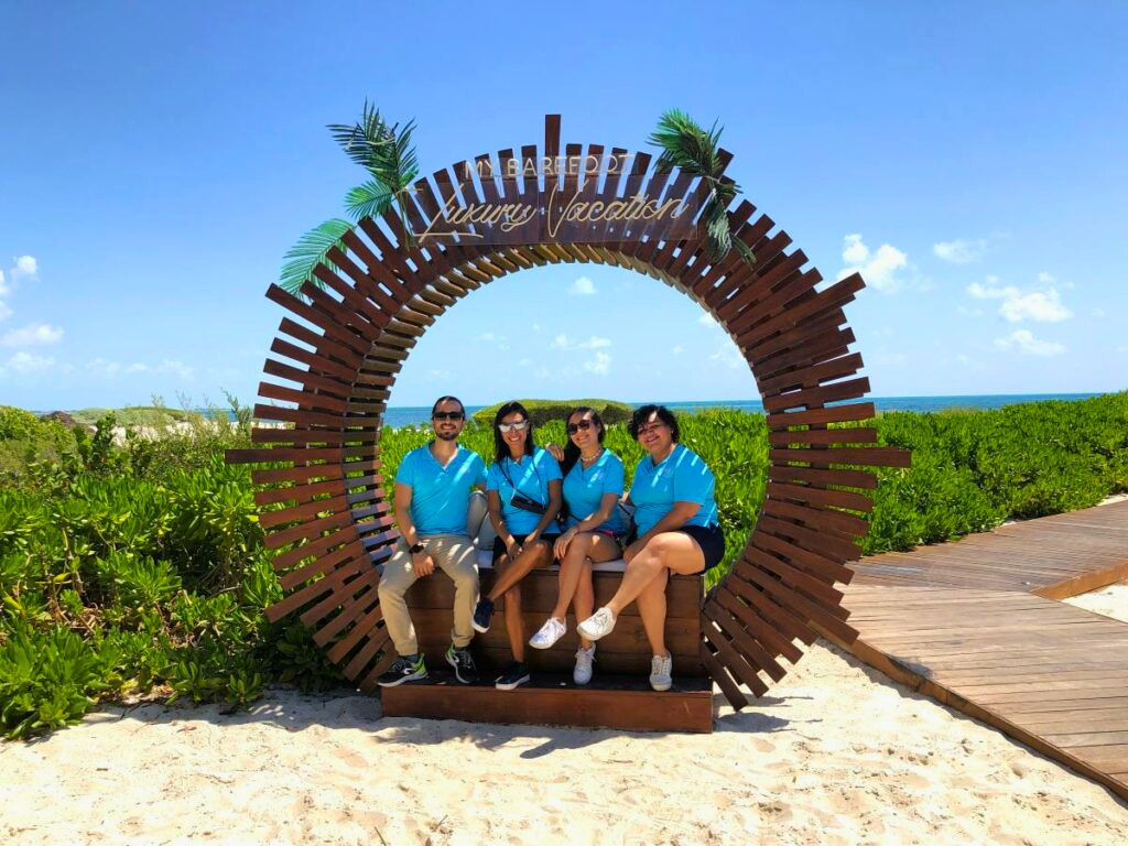 The Hola Weddings Team posing at Atelier Playa Mujeres resort