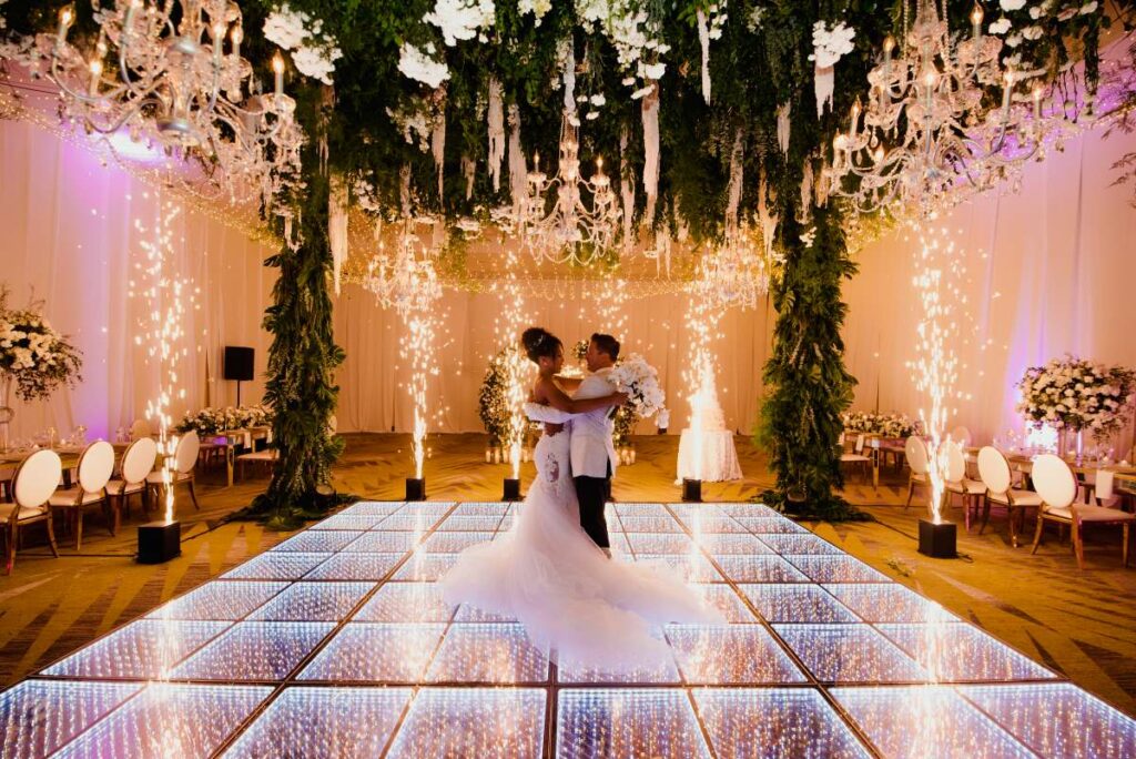 wedding couples first dance in a beautiful ballroom at dreams natura