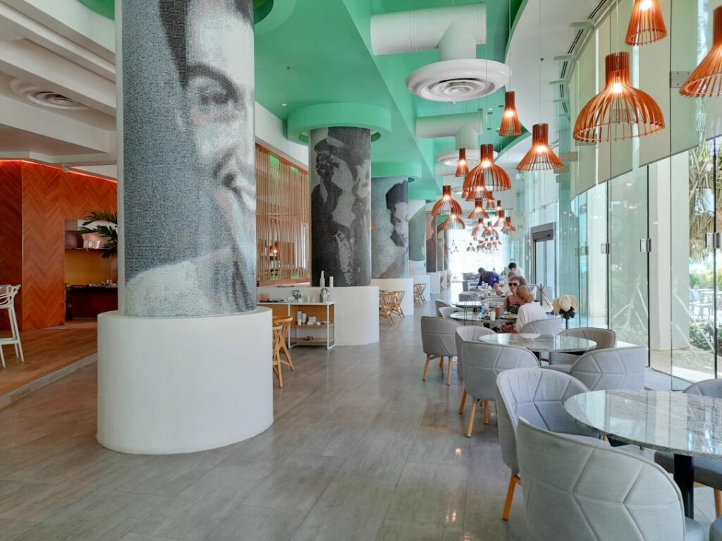 Restaurant with gray chairs and wooden lamps
