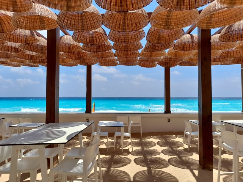 Restaurant next to the beach with wooden lamps
