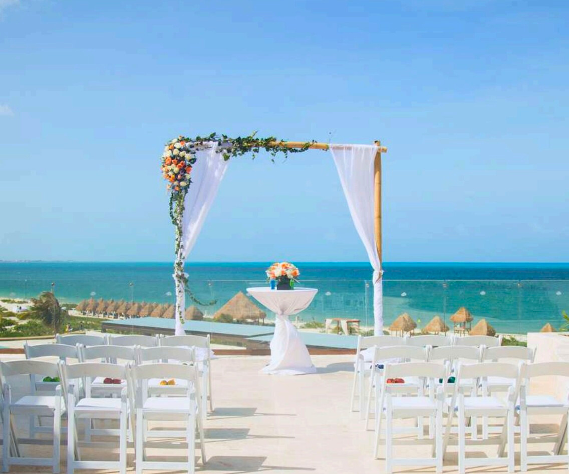 Resort terrace with ocean view an a white wedding gazebo