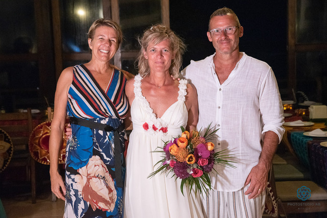 wedding couple in white with wedding planner