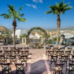 Wedding ceremony setting at a rooftop terrace with a circle of flowers
