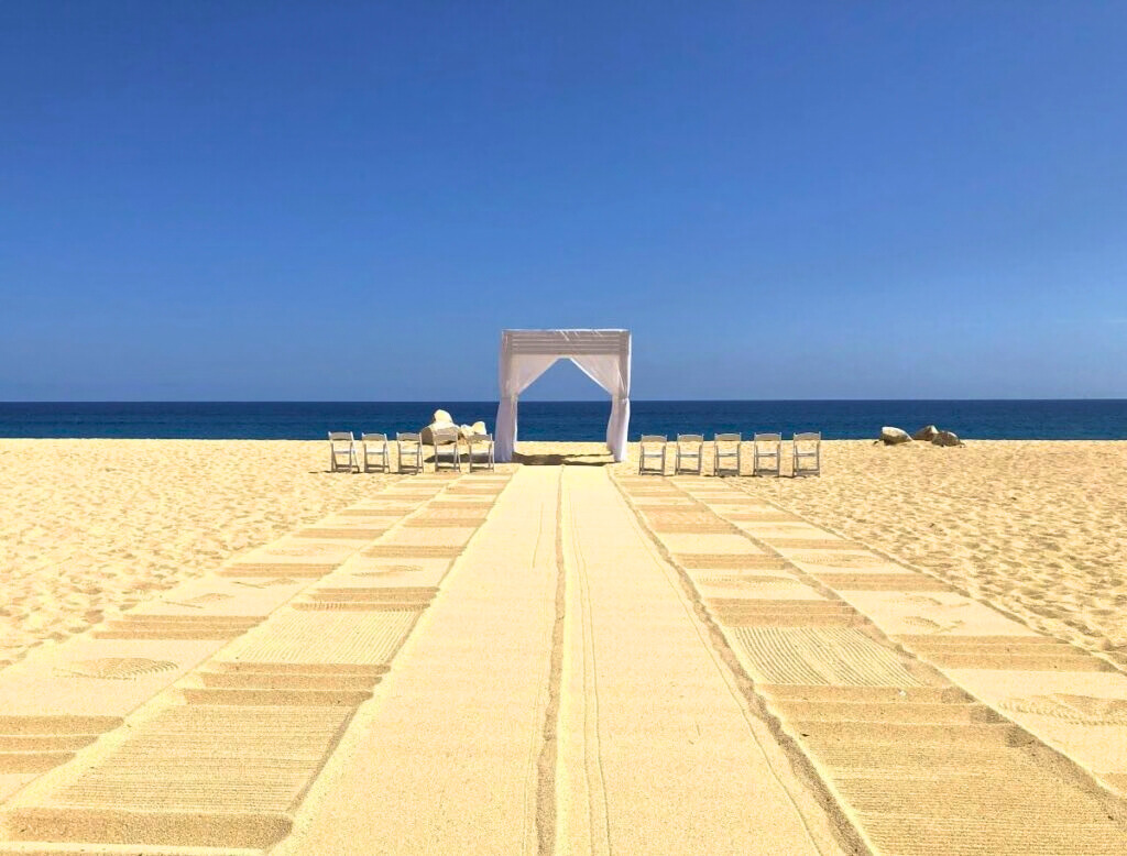 Resort beach with setup for a wedding ceremony