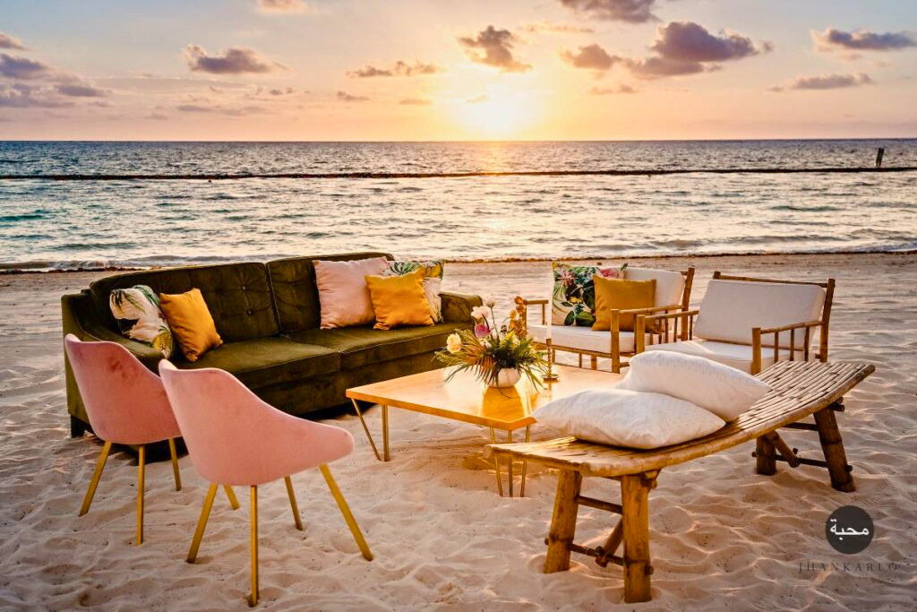 Lounge furniture on an ocean view terrace for a wedding cocktail