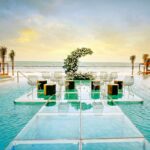 Amazing wedding ceremony set up over the water in a pool