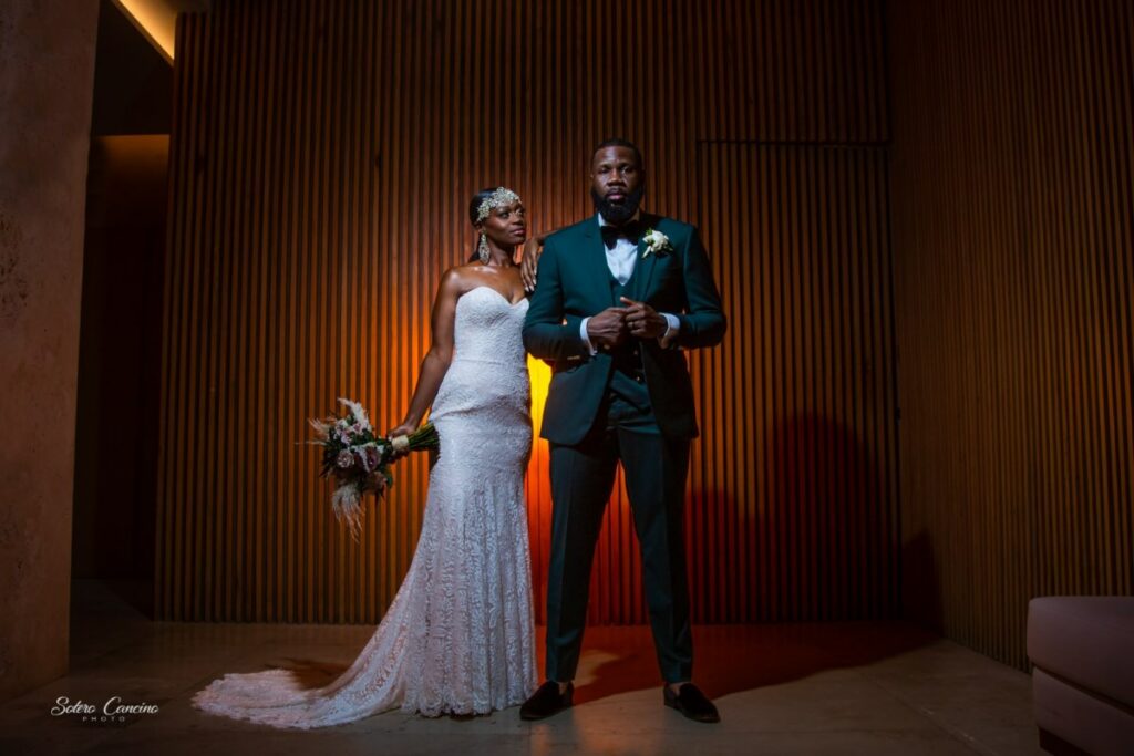 a wedding couple posing at the fives beach resort