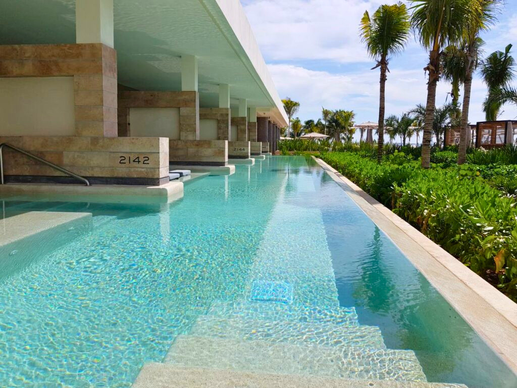 Resort swimup pool area connecting with several rooms