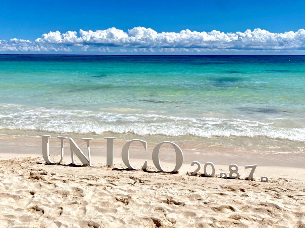 unico weddings resort beach sign