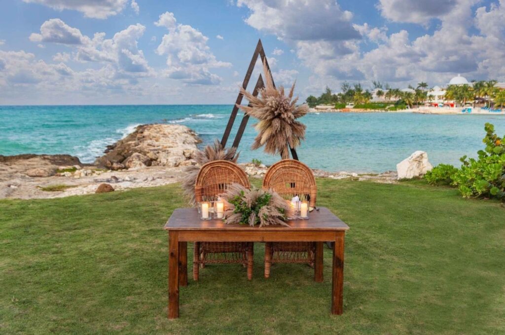 Garden near the shore with a table for a wedding ceremony