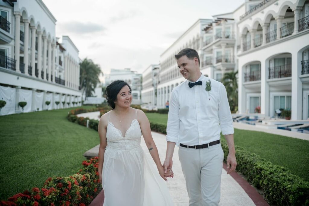 wedding couple holding hands at the hilton in playa del carmen