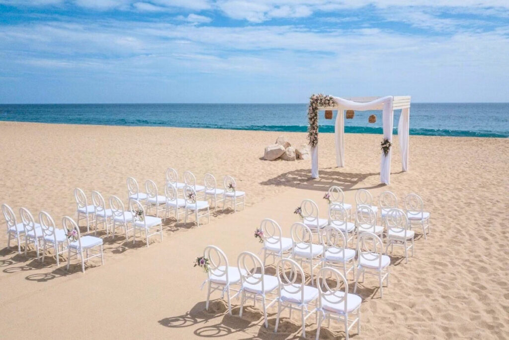 Resort beach area with set up for a wedding ceremony